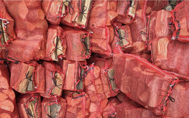 Bags of seasoned hardwood firewood